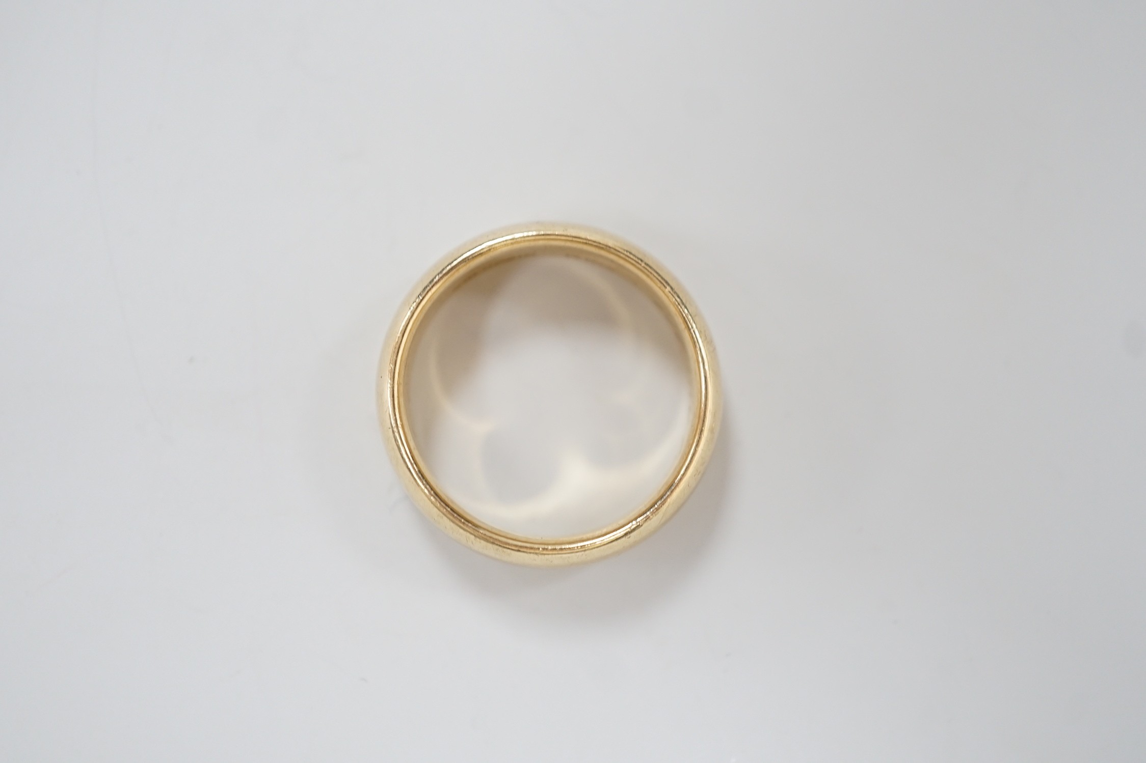 A 14k wedding band, stamped 'Columbia' and inscribed 'All my love Nancy', size U, 11.6 grams.